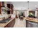 Modern kitchen features granite counters, stainless steel appliances, and stylish backsplash at 8047 W Cinder Brook Way, Florence, AZ 85132