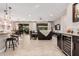 Open kitchen with island, dark cabinetry, and a breakfast nook at 8047 W Cinder Brook Way, Florence, AZ 85132