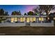 Back exterior view of home with patio and modern finishes at 8165 E Del Cuarzo Dr, Scottsdale, AZ 85258