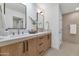 Modern bathroom with double vanity, quartz countertop, and plenty of storage at 8165 E Del Cuarzo Dr, Scottsdale, AZ 85258