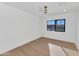 Bright bedroom with light wood floors and a window offering an outdoor view at 8165 E Del Cuarzo Dr, Scottsdale, AZ 85258