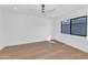 Spacious bedroom featuring light wood floors and a large window at 8165 E Del Cuarzo Dr, Scottsdale, AZ 85258