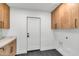 Laundry Room with modern cabinets and flooring at 8165 E Del Cuarzo Dr, Scottsdale, AZ 85258