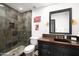 Elegant bathroom with a walk-in shower, concrete countertop, and dark vanity at 8255 E Vista De Valle --, Scottsdale, AZ 85255