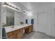 Double vanity bathroom with a shower and tile flooring at 8392 W Oraibi Dr, Peoria, AZ 85382