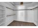 Large walk-in closet with shelving and rod at 8392 W Oraibi Dr, Peoria, AZ 85382