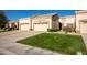 Two-car garage, well-maintained landscaping, and a charming facade at 8392 W Oraibi Dr, Peoria, AZ 85382