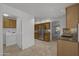 Kitchen with laundry area and modern appliances at 8392 W Oraibi Dr, Peoria, AZ 85382