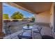 Covered patio with seating area and backyard view at 8392 W Oraibi Dr, Peoria, AZ 85382