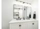 Modern bathroom with double vanity and contemporary lighting at 8631 E Jackrabbit Rd, Scottsdale, AZ 85250