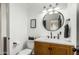 Stylish bathroom featuring a sleek vanity and large mirror at 8631 E Jackrabbit Rd, Scottsdale, AZ 85250