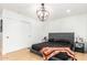 Primary bedroom with platform bed and large closet at 8631 E Jackrabbit Rd, Scottsdale, AZ 85250