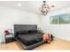 Primary bedroom with platform bed and statement lighting at 8631 E Jackrabbit Rd, Scottsdale, AZ 85250