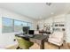 Home office with built-in shelving and large window at 8631 E Jackrabbit Rd, Scottsdale, AZ 85250