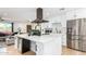 Modern kitchen with white cabinets, quartz countertops, and stainless steel appliances at 8631 E Jackrabbit Rd, Scottsdale, AZ 85250