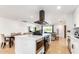 Modern kitchen island, white shaker cabinets, stainless steel appliances at 8631 E Jackrabbit Rd, Scottsdale, AZ 85250