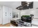 Modern kitchen with stainless steel appliances and white cabinetry at 8631 E Jackrabbit Rd, Scottsdale, AZ 85250