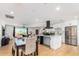 Bright and airy kitchen and dining area with hardwood floors at 8631 E Jackrabbit Rd, Scottsdale, AZ 85250