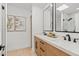 Double vanity bathroom with modern light wood cabinets and matte black fixtures at 8779 E Vía De Sereno --, Scottsdale, AZ 85258