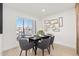 Bright dining area with a table for four and sliding glass doors to patio at 8779 E Vía De Sereno --, Scottsdale, AZ 85258