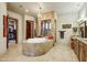 Luxurious bathroom with a large soaking tub and walk-in shower at 8787 E Lost Gold Cir, Gold Canyon, AZ 85118