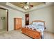 Well-lit bedroom with wooden furniture and carpet flooring at 8787 E Lost Gold Cir, Gold Canyon, AZ 85118