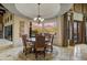 Elegant dining room with large windows and mountain views at 8787 E Lost Gold Cir, Gold Canyon, AZ 85118