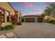 Attached two-car garage with stone facade and paver driveway at 8787 E Lost Gold Cir, Gold Canyon, AZ 85118