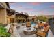 Relaxing patio with fire pit and built-in seating at 8787 E Lost Gold Cir, Gold Canyon, AZ 85118