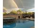 Stunning pool and spa with double rainbow backdrop at 8787 E Lost Gold Cir, Gold Canyon, AZ 85118