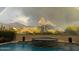 Luxury backyard oasis featuring a refreshing pool, spa, and mountain views at 8787 E Lost Gold Cir, Gold Canyon, AZ 85118