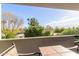 Balcony view showcases a lush green landscape and a clear sky at 902 W Glendale Ave # 203, Phoenix, AZ 85021