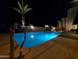 Night view of the refreshing community pool at 902 W Glendale Ave # 203, Phoenix, AZ 85021