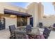 Outdoor patio with seating area, glass top table, and awning at 902 W Glendale Ave # 203, Phoenix, AZ 85021