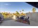 Private rooftop patio with seating area, city views, and colorful rug at 902 W Glendale Ave # 203, Phoenix, AZ 85021