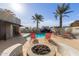 Community pool with lounge chairs and fire pit at 902 W Glendale Ave # 203, Phoenix, AZ 85021