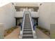 Modern condo building with gray staircase and blue accents at 902 W Glendale Ave # 203, Phoenix, AZ 85021