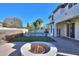 Pool and spa with fire pit and paved patio at 910 E Canyon Way, Chandler, AZ 85249