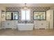 Spacious bathroom with double vanities, free-standing tub, and patterned tile at 910 E Canyon Way, Chandler, AZ 85249