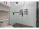 Clean bathroom with glass shower, white tile and black accents at 910 E Canyon Way, Chandler, AZ 85249