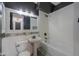 Modern bathroom with white tub and patterned tile at 910 E Canyon Way, Chandler, AZ 85249