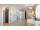 Elegant bathroom with a freestanding tub, walk-in shower, and / vanities at 910 E Canyon Way, Chandler, AZ 85249