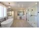 Luxurious bathroom with soaking tub, walk-in shower, and separate vanities at 910 E Canyon Way, Chandler, AZ 85249