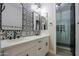 Modern bathroom with double vanity, patterned tile, and glass shower at 910 E Canyon Way, Chandler, AZ 85249