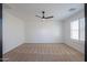 Simple bedroom with carpet flooring and a ceiling fan at 910 E Canyon Way, Chandler, AZ 85249