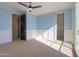 Bedroom with light blue walls, wainscoting, and a walk-in closet at 910 E Canyon Way, Chandler, AZ 85249