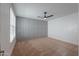 Spacious bedroom with gray accent wall and ceiling fan at 910 E Canyon Way, Chandler, AZ 85249