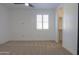 Simple bedroom with carpeted floor, ceiling fan and window at 910 E Canyon Way, Chandler, AZ 85249