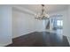 Bright dining room with dark hardwood floors and elegant chandelier at 910 E Canyon Way, Chandler, AZ 85249