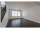 Modern dining room with dark hardwood floors and chandelier at 910 E Canyon Way, Chandler, AZ 85249